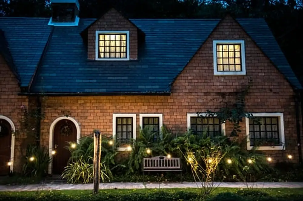 Home in Greater Boston lit at dusk after an exterior lighting install by Just Electric LLC